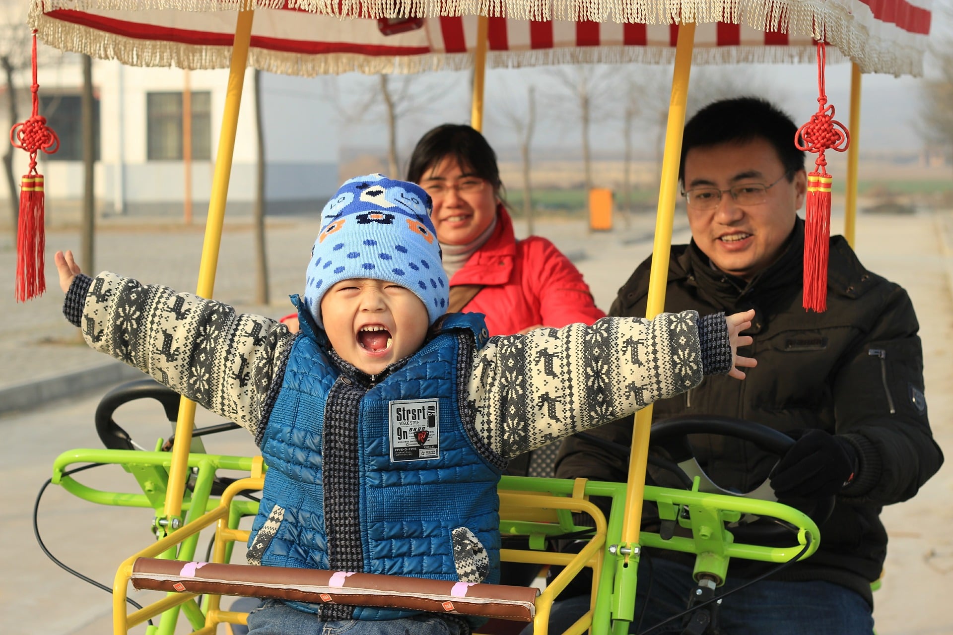 Happy Chinese family in a cart