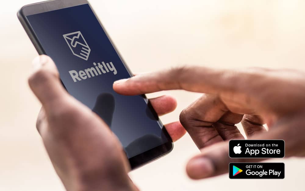 A close up of a person sending money with the Remitly app