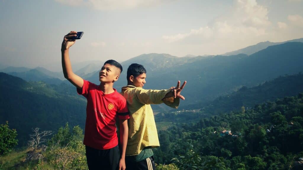send money to nepal with remitly using a mobile phone like these nepali boys