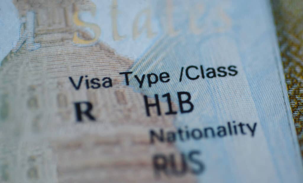H1B prevailing wage: passport with Visa Type R H1B