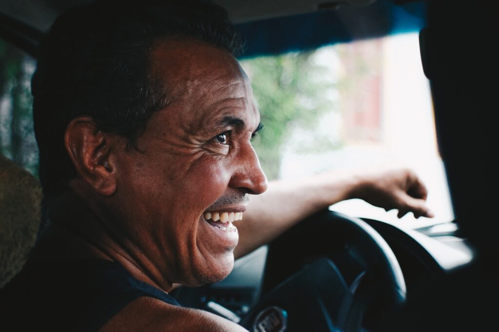 A driver smiling
