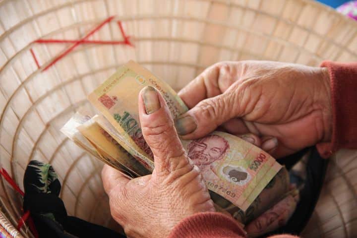 Safely Send Money to Vietnam - a person counting money