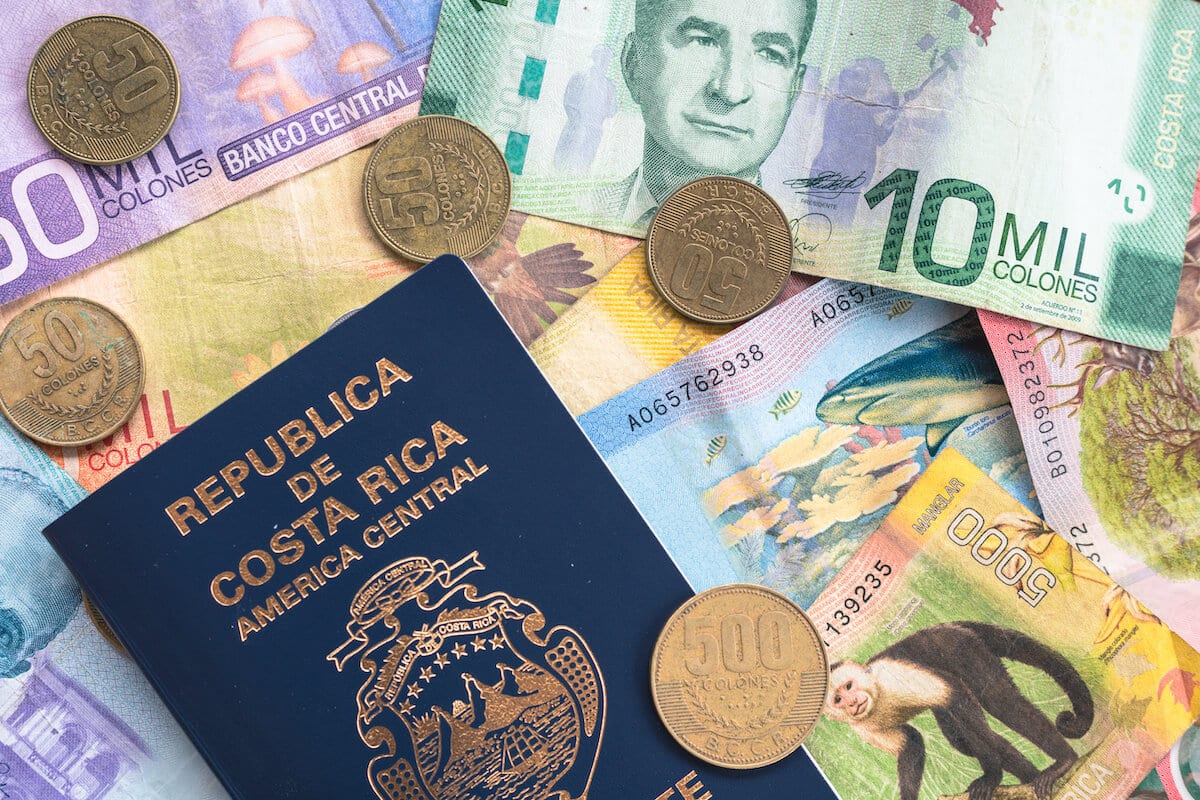 Costa rica currency: bills, coins and a passport