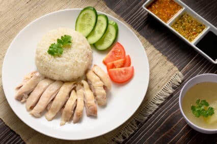 Hainanese,Chicken,Rice,With,Soup,And,Three,Sauces,On,Dark