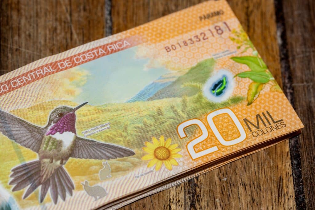 Costa Rica currency the colon featuring beautiful world currency design of hummingbird