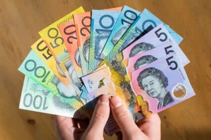 Australian currency the Australian dollar displayed in a hand in a list of most beautiful currencies