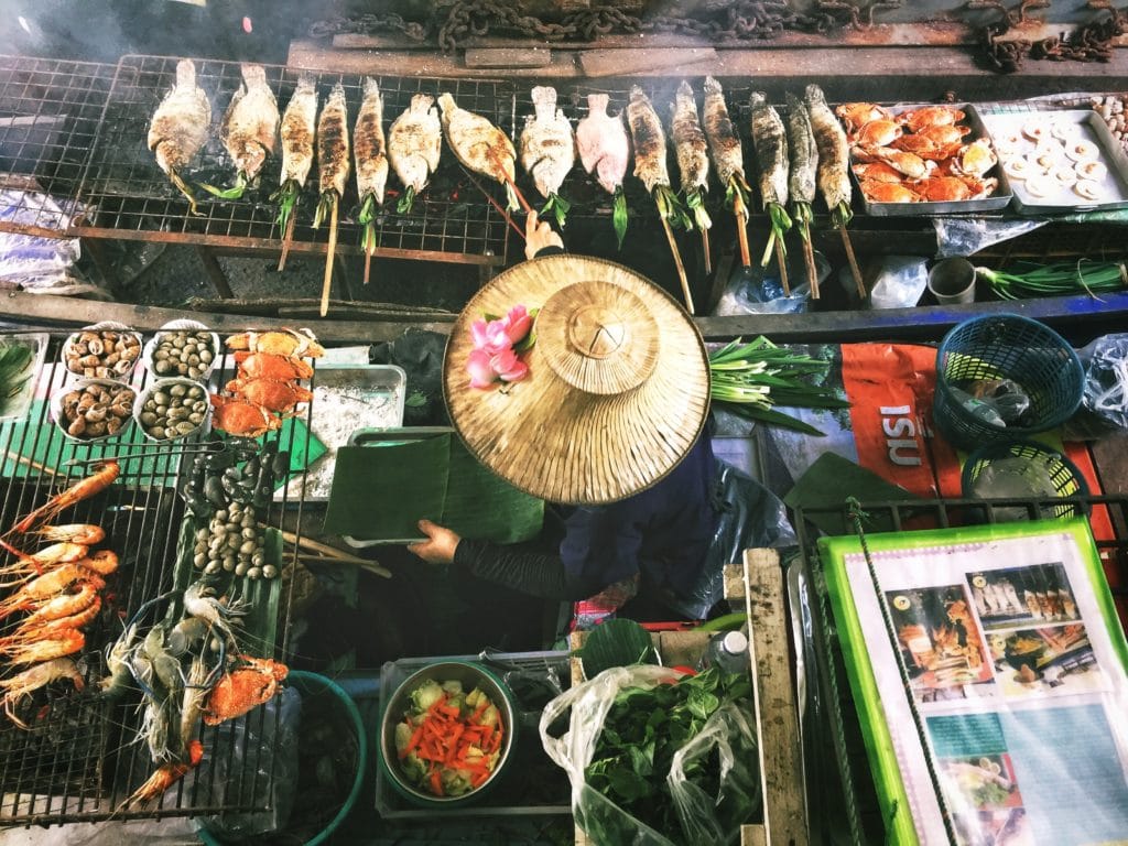 A person preparing food in Thailand