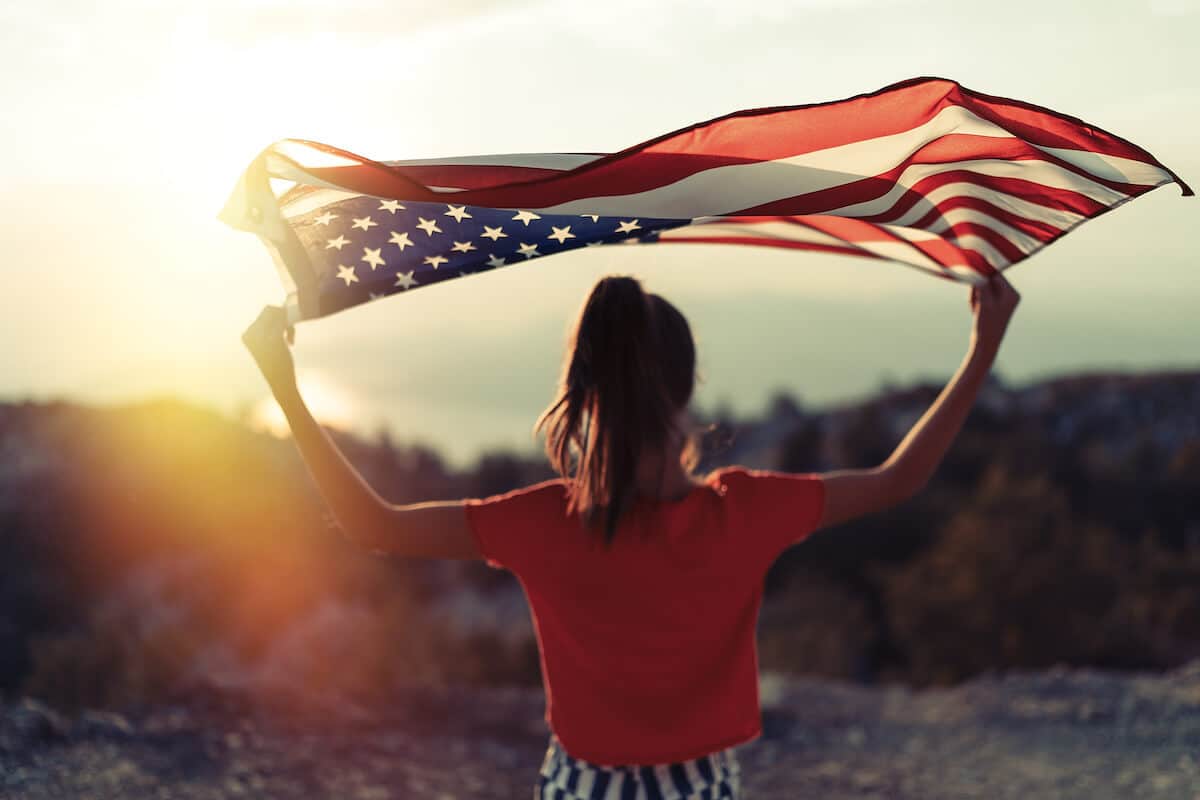 Woman holding the US flag