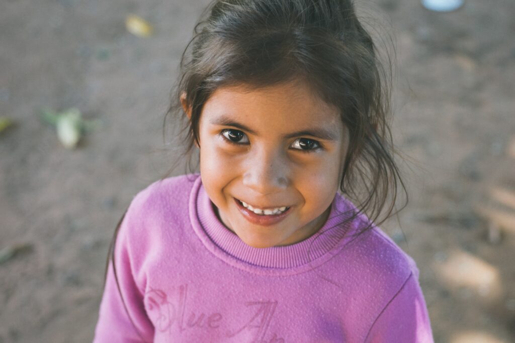 young girl in a country where her family receives remittances to support her education