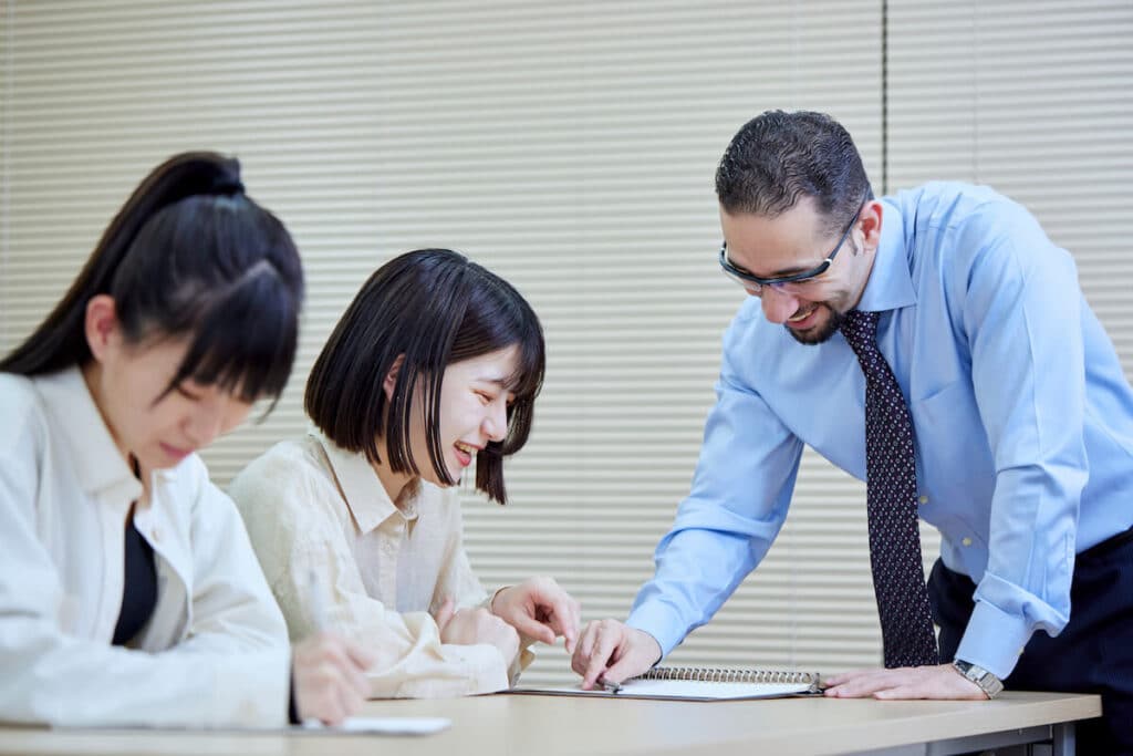 Japan work visa: instructor teaching a student