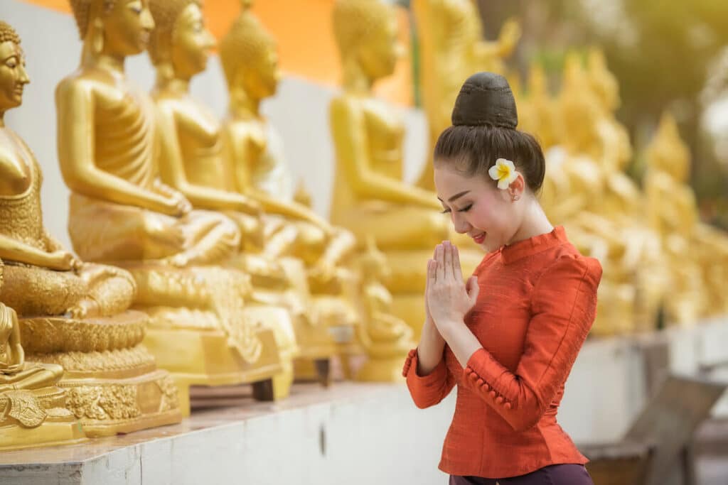Woman praying at a temple
