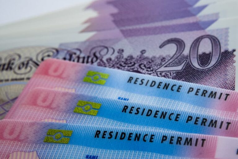 How to get a work visa in the UK: UK Residence Permit cards and £20 bills