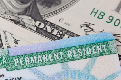Alien registration number: Permanent Resident card and US dollar bills