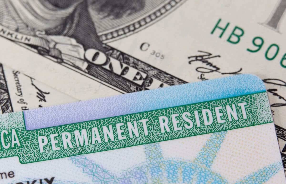 Alien registration number: Permanent Resident card and US dollar bills