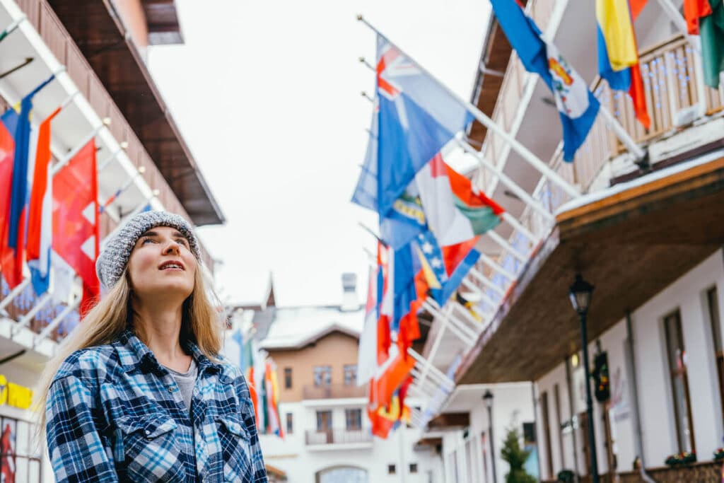 Woman looking at different flags
