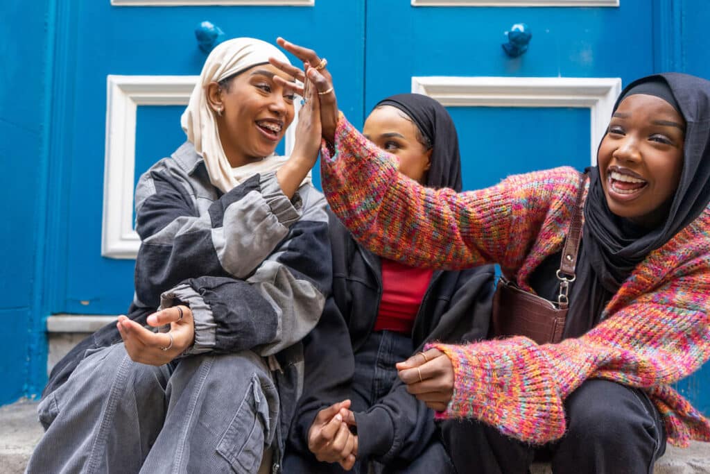 UK citizenship: 3 women happily doing the high five