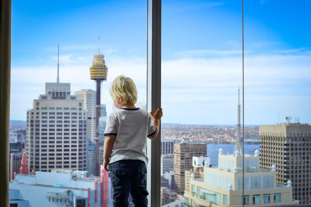 Moving to Australia: boy looking out a window