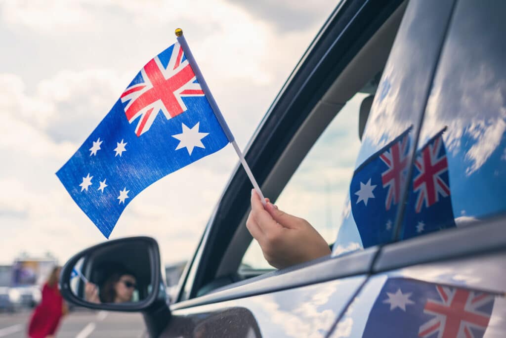 Person holding the Australian flag