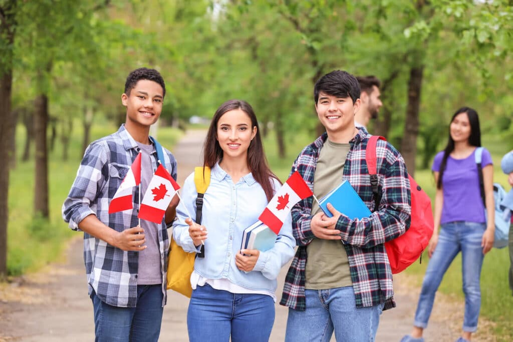 Students holding Canadian flags