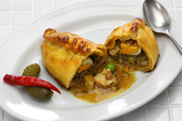 homemade saltena, empanada with a juicy filling, Bolivian breakfast