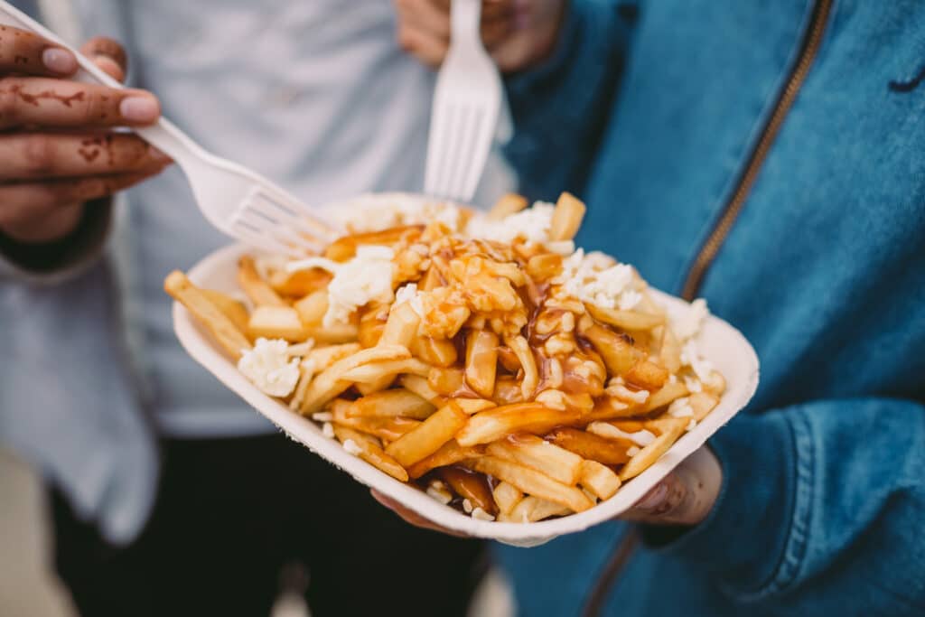 Poutine,Being,Eaten,With,Forks