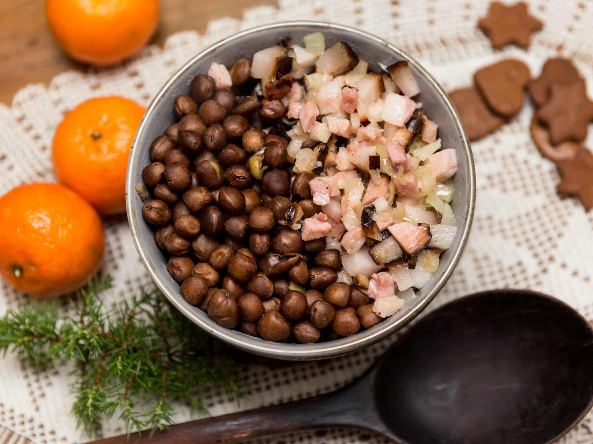 a bowl of gray peas with bacon