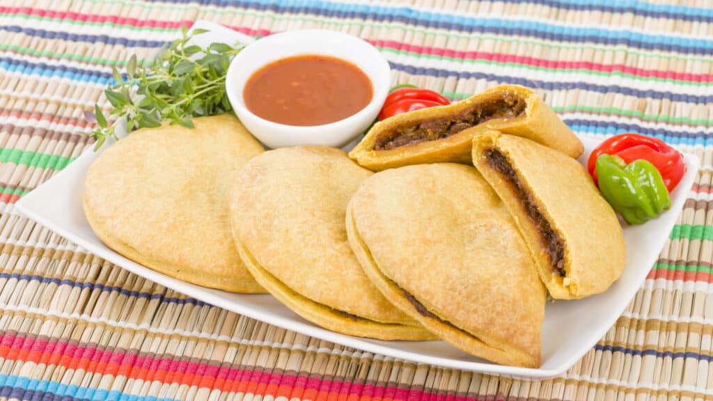 These beef patties on a tray are among the most famous of Jamaican dishes