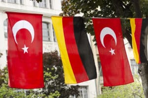 Flags of Germany and Turkey hanging outside on a street in Kreuzberg, Berlin.