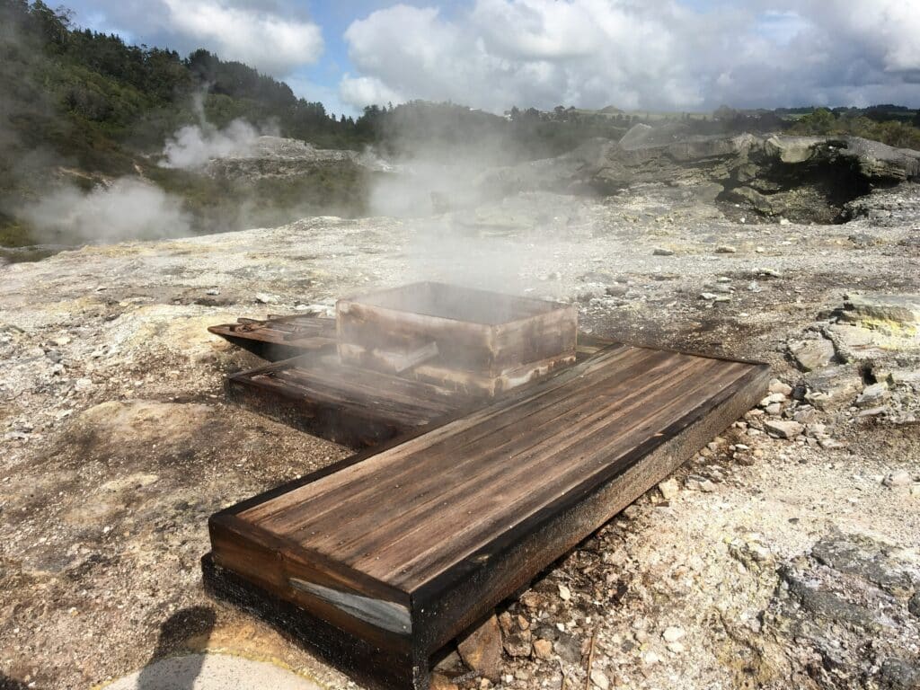 Hangi, a traditional cooking method using heated rocks buried in a pit oven in Rotorua, BayPlenty, New Zealand