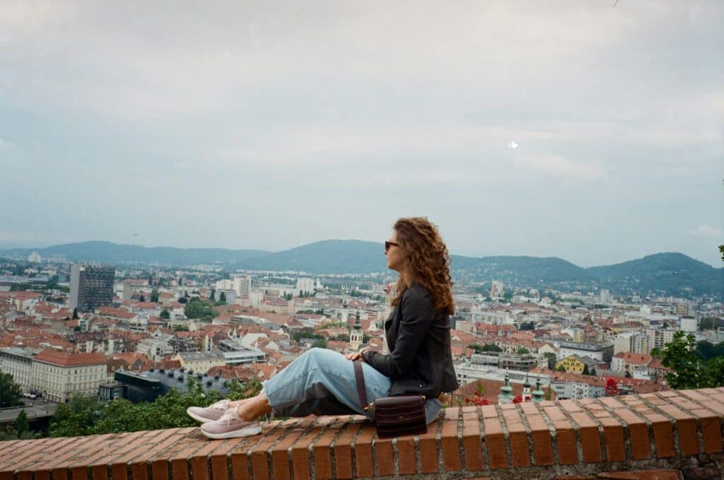 A woman looking at the old city in Graz