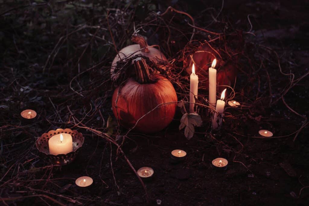 picture of pumpkins with tea candles and tall candles