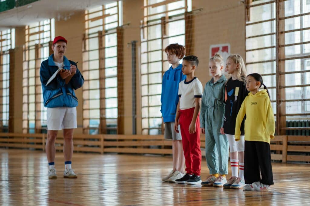 PE teacher talking to students