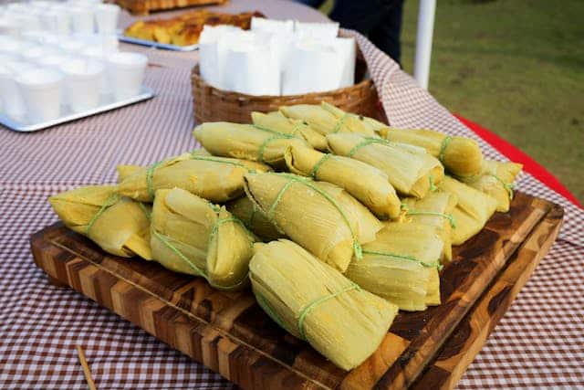 Tamales piled up on a table