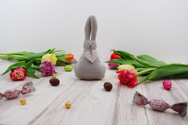 Spring flowers, Easter candy, and a bunny stuffed animal